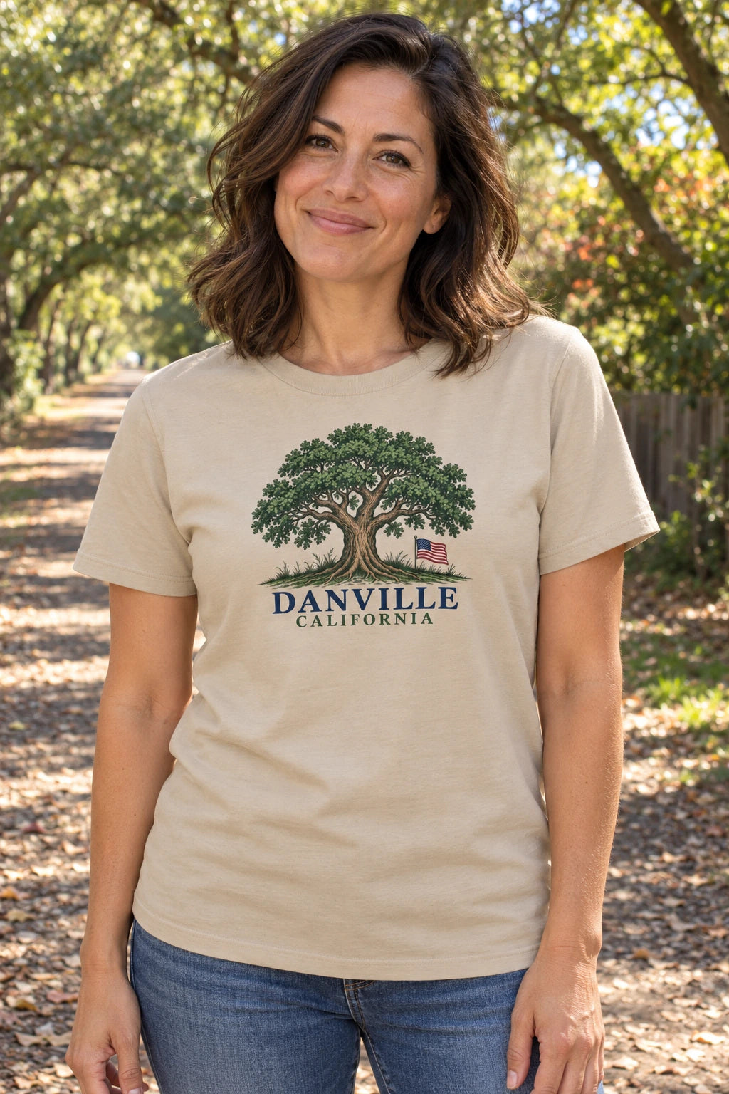 Danville Oak & Flag | Organic Tee in Desert Dust, shown on an adult model in Danville. Generated lifestyle visualization matching the saved supplier front.